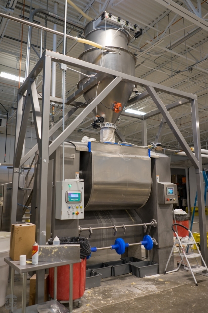 Flour is fed into the mixer from the large hopper above